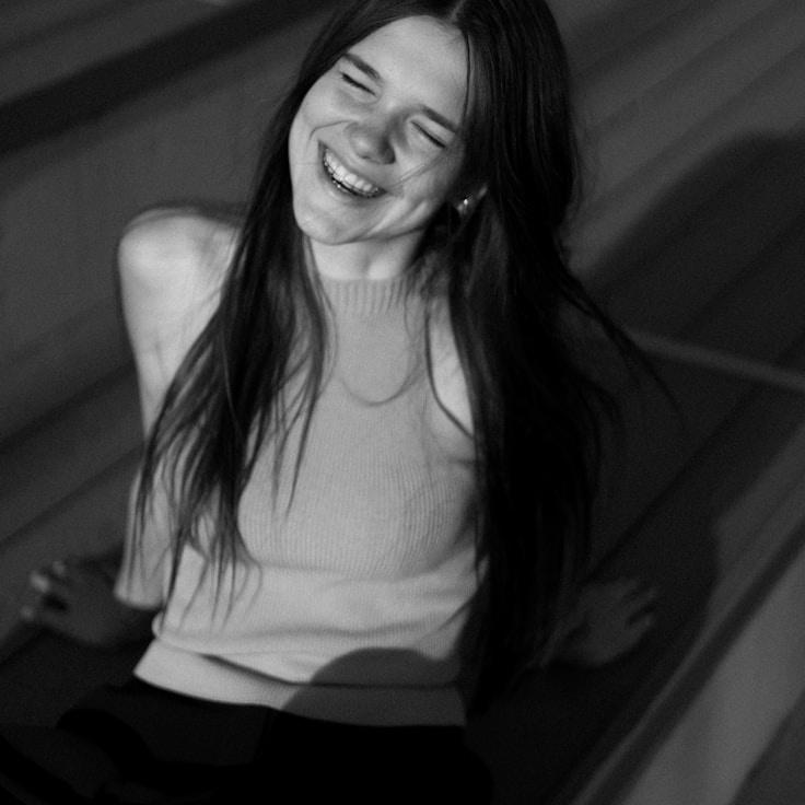 Kaveri Mehta, Lead Design Curator at MeadowMatrixZone, reviewing corporate floral arrangements